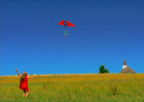 girl flying kite